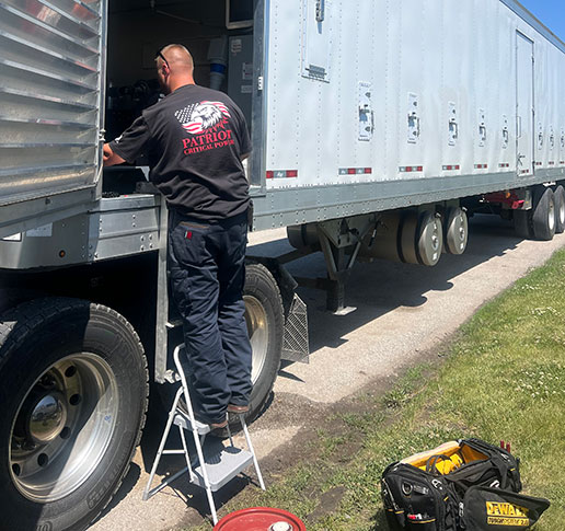A Patriot Critical Power employee working at a job site