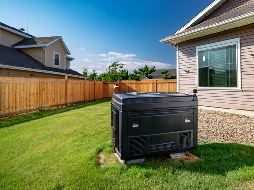 A home generator unit sits outside a single-story house